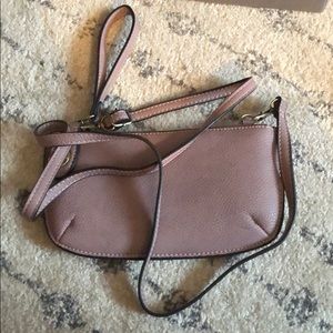 Small cross-body purse or wristlet.